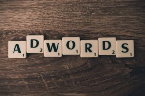 Letter blocks spelling Adwords which is a part of creating business ideas. 