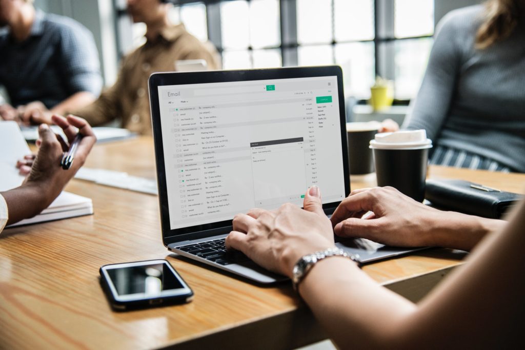 Person on laptop looking through mailing list